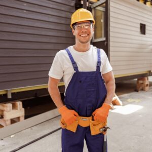 cheerful male builder standing at construction sit 2022 01 19 00 13 05 utc